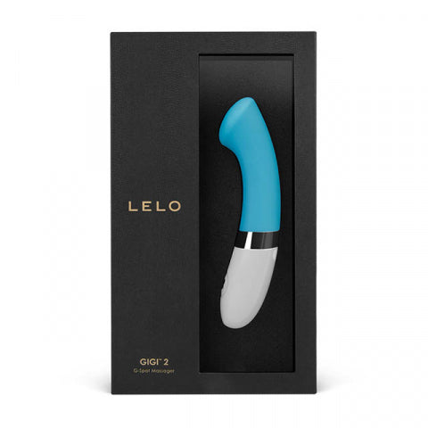 Lelo Gigi 2 G-spot vibrator in turquoise displayed inside its elegant black packaging with USB charging cable and satin storage pouch.