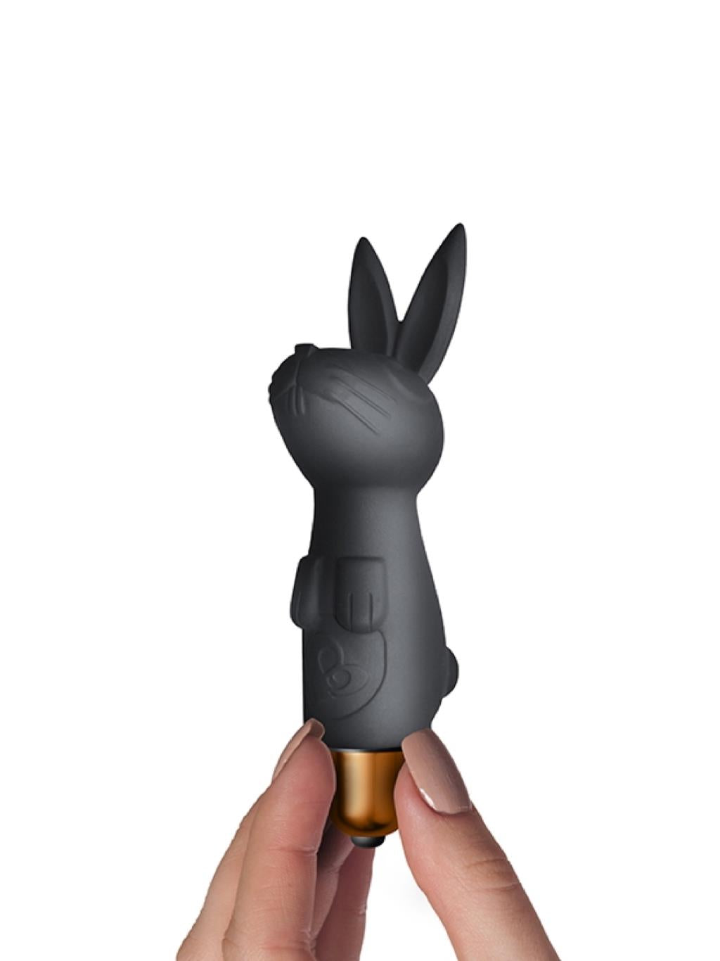 Bunny ear vibrator held in hand to show compact size and sleek black design