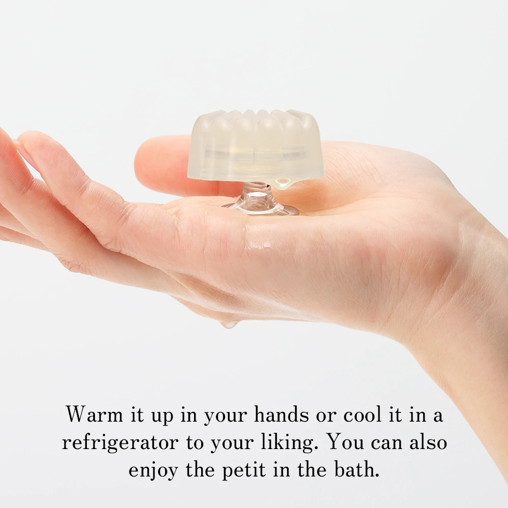 Palm-sized Iroha Petit Shell single-use stimulator, demonstrating its softness and portability