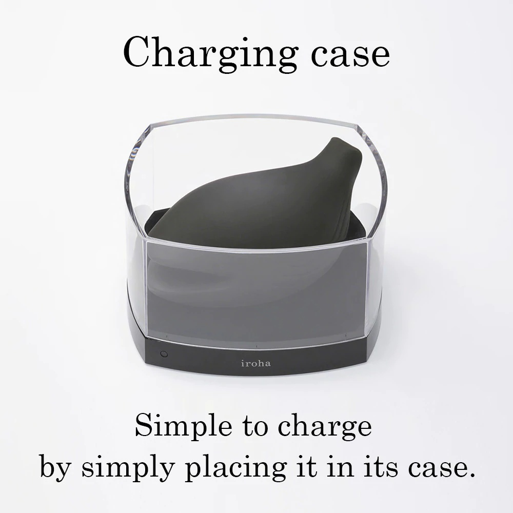 charging case closed, sleek white design next to the vibrator