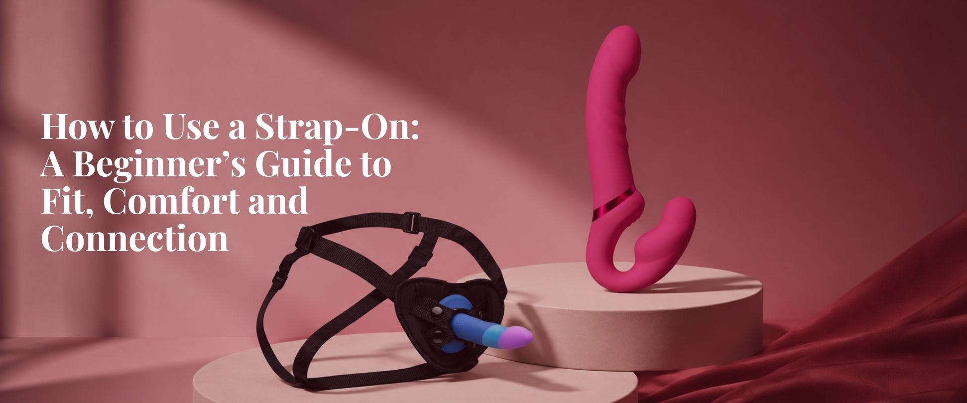 Swan Addiction hollow strap-on and harness displayed on an elegant blush background