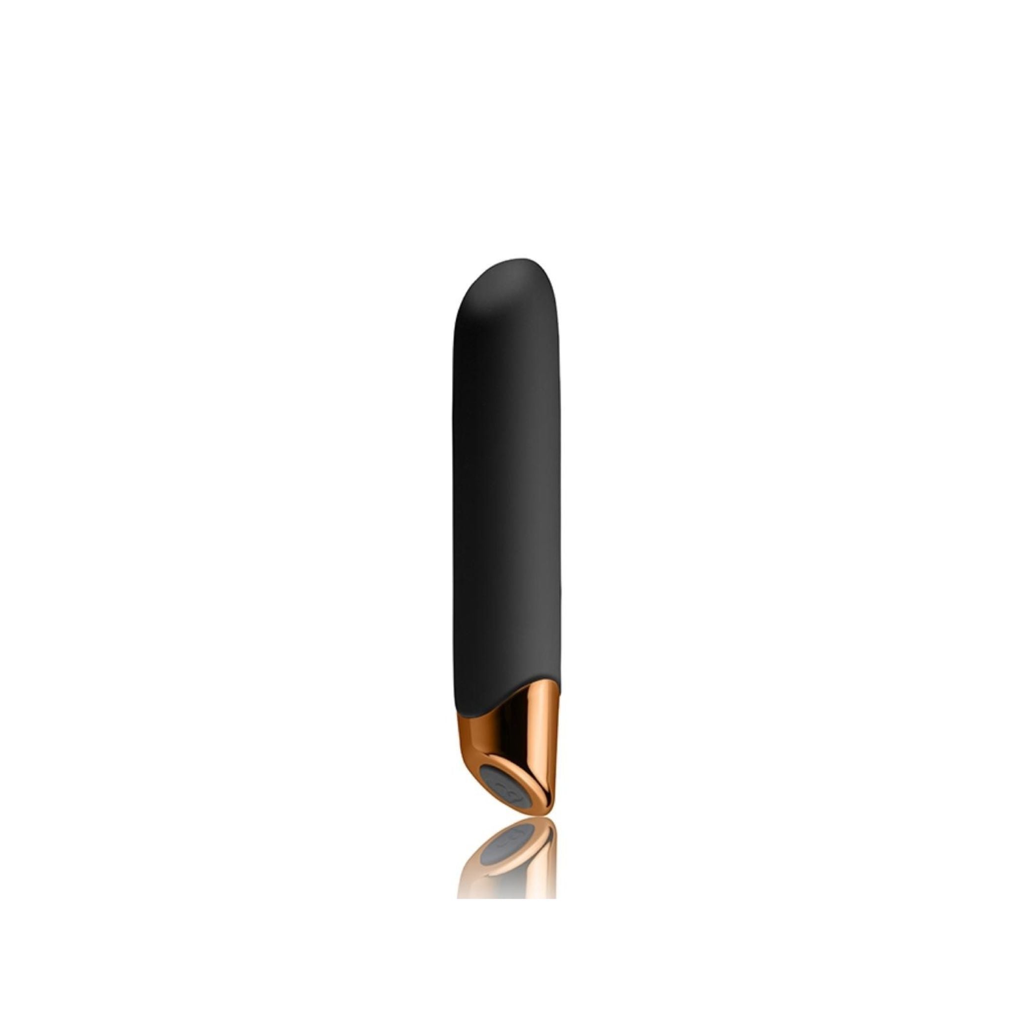 Hand holding the bullet vibrator, showing compact size and premium finish