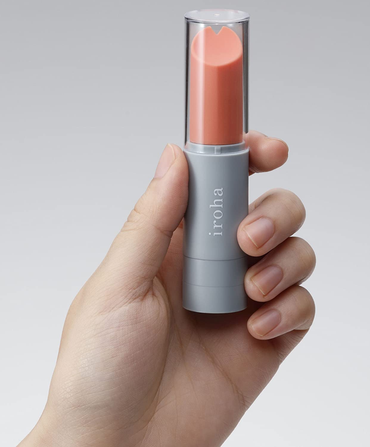Tenga Iroha Lipstick Vibe held in hand to show its compact, discreet size and soft-touch finish.