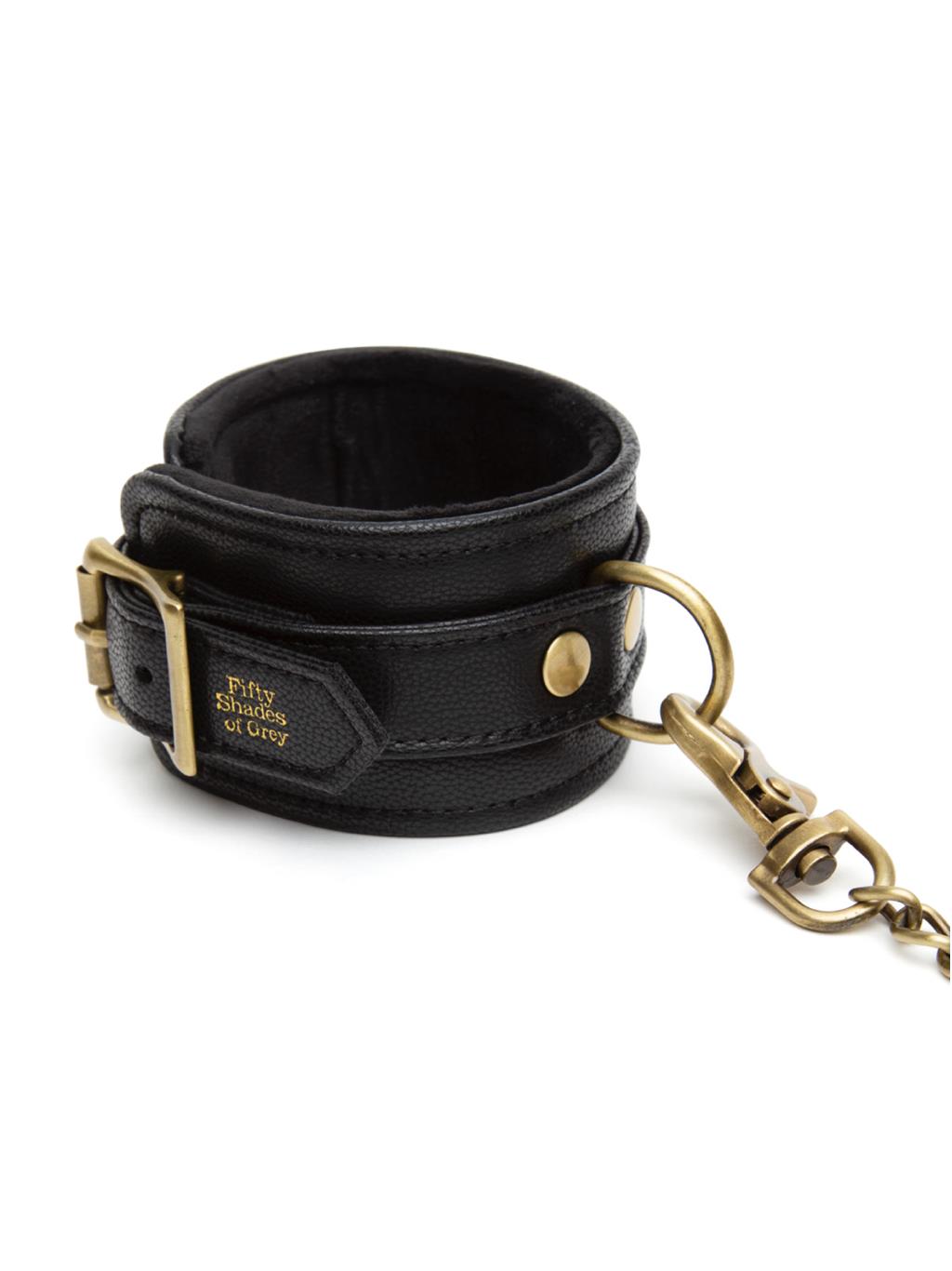 Close-up of Bound to You Ankle Cuffs’ gold buckles and fine stitching, showing quality craftsmanship and soft faux leather finish.