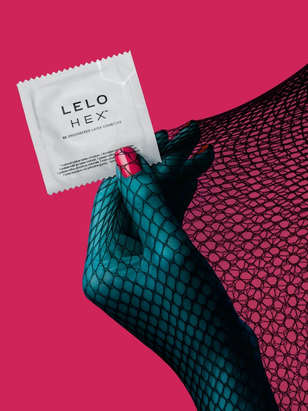 Hand holding LELO HEX condom pack, emphasizing compact, discreet packaging